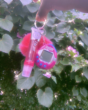 
            
                Load image into Gallery viewer, 90’s Babe Tamagotchi Lipgloss Key Chain ✨✨ Glo Babe 
            
        